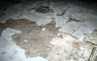 An image of a concrete floor with moisture issues.